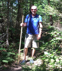 hiker with wooden staff